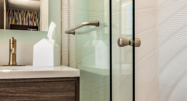 Queen Guest Room with Sleeper chair. Queen Guest Bathroom with large sliding shower doors, and essentials.
