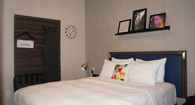 Full Bath Full size bed with suitcase holder and laundry bag. Lamp with night stand.